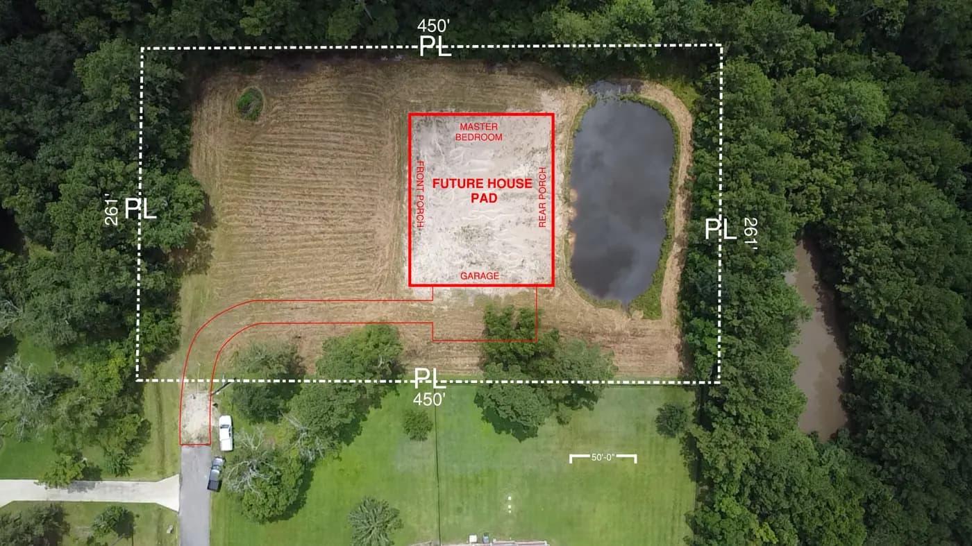 Aerial view of a cleared construction lot with a site plan overlay